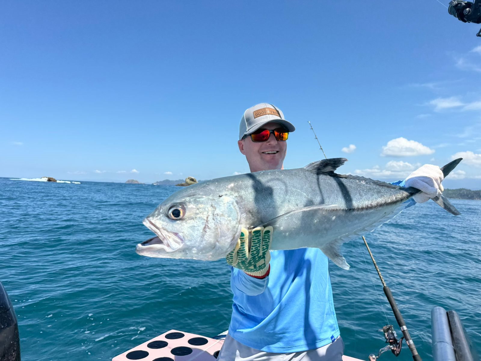 Angler holding a large silver inshore fish