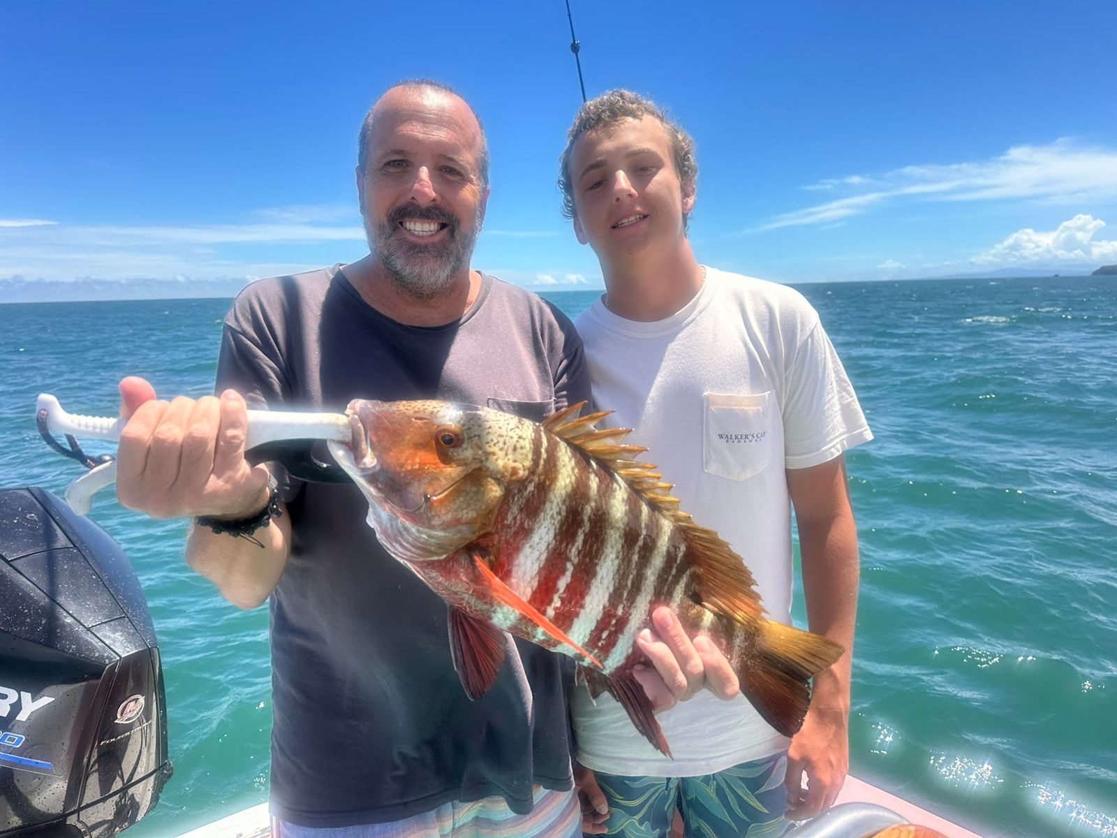 Happy couple displaying their colorful catch